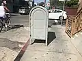 A USPS storage box in Venice, Los Angeles, California, in 2018 with the olive green USPS colouring scheme used between World War I and 1955