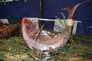 Madai as an auspicious object, with straw bindings and coins at Osaka Tenmangū shrine