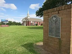 Texas historical marker at Pattison United Methodist Church marks the site of the old railroad depot.