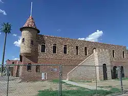 Different side view of El Cid Castle located at the Northwest corner of 19th Ave and West Cholla Drive in Phoenix. Restoration of the building was completed in 2014.  In January 2015, it opened as an office of the Arizona Department of Eco nomic Security.