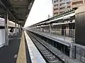 Station platforms now configured as two side platforms. Note the fence on the former island platform and the rough edges where the concrete of the old platform 1 has been truncated.