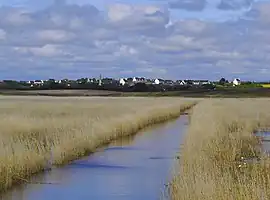 A distant view of Plovan, from the tidal marshes of the Bay of Audierne.