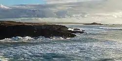 The island of Pessegueiro as seen from the village of Porto Covo, during a winter storm