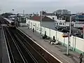 South West Trains EMU 450101 passes through the Up platform with the 1124 Basingstoke-Brighton service on 17 February 2007