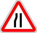 Road narrows on left