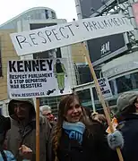 Toronto protest in Dundas Square showing a related sign about Canada and Iraq War resisters