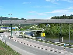 Revelelva on right side of the E6, continuing on right side under the bridge of E12 towards Sweden