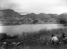 Hill's survey party enjoying a meal along the banks of the Rio Grande, Brewster County, Texas (1899)