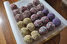 Romkugler (Denmark). Cocoa and rum flavoured balls of cookie butter rolled in a variety of sprinkles.