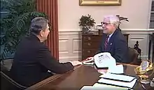 Video still of President Ronald Reagan in the Oval Office conversing with Jack Reed