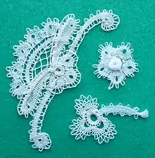 part lace motifs, before being assembled