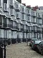 Houses on Royal Crescent, Brighton are entirely faced with black mathematical tiles Location on Google Maps