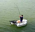 Angling from a small inflatable on Saint-Cassien's lake, France