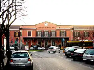 Square two-story building with hip roof