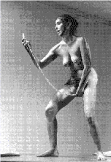 Carolee Schneemann, performing her piece Interior Scroll, 1975.