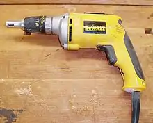 A DeWalt screw gun, used for countersinking drywall screws.