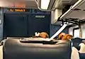 Seat check on headrest of an NJ Transit Bombardier MultiLevel Coach, note the special clip on the headrest for the seat check.