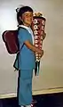 A West German school girl with Schultüte in 1970, with a 'hippyish' outfit on.