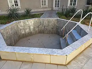 A pool of holy water in the center of the inner courtyard of the church