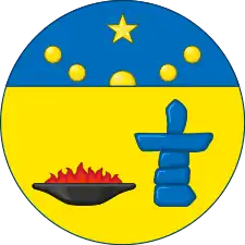 The arms of Nunavut is depicted on a traditional round shield