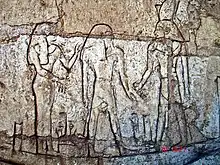 Shoshenq III, standing on the boat "msktt", the boat of the night, with the god Atum. From his tomb in Tanis.