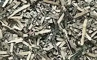 Shreds of unfit US dollar notes with a typical size of less than 1.5 mm × 16 mm