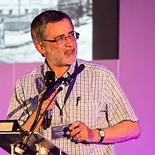 Sir Richard Treisman speaking at a conference in 2015