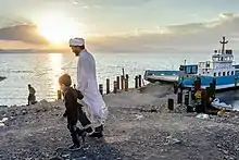 People visiting a boat on Lake Urmia