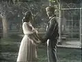 Liesl and Rolf singing in front of the gazebo on a Hollywood sound stage.