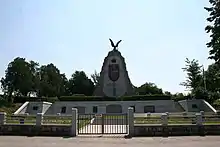 A large stone monument topped by an eagle.