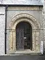 Norman revival door on porch (S)