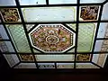 Stained glass ceiling light over main staircase