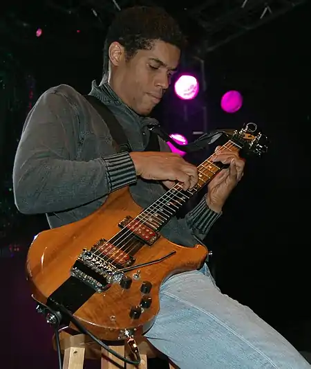 Stanley Jordan plays guitar.