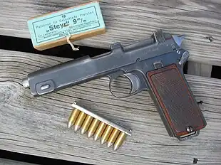 Steyr M1912 pistol with box and stripper clip of 9×23mm Steyr ammunition