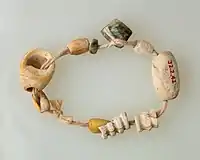 String of beads; 4400–3800 BC; the beads are made of bone, serpentinite and shell; length: 15 cm; Metropolitan Museum of Art