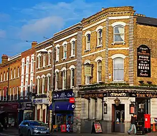 Buildings and shopfronts in the High Street conservation area near the station