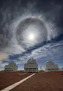 Three telescopes stand sentry under an unusual skyscape in this image from Cerro Tololo Inter-American Observatory (CTIO)