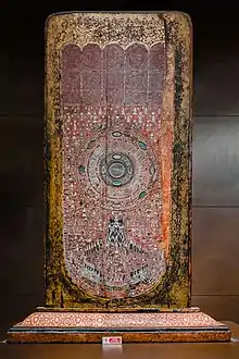 Buddhapada, Teak wood decorated with mother of pearl and glass. Lanna art, late 15th - early 16th centuries. Wat Phra Singh Woramahaviharn.