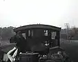 On a train engine, robbers fight the train crew