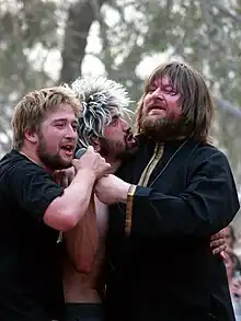 Singer Ebbot Lundberg (right) in the crowd with two fans at the Meredith Music Festival, December 2006