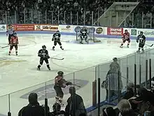 In-game hockey action at a pee-wee tournament