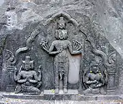 Sadasiva standing midst Brahma and Vishnu. 10th c. CE sculpture at Vat Phou, Laos