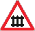 Railroad crossing with barrier