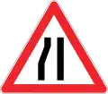 Road narrows on left side