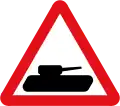 Slow-moving military vehicles likely to be in or crossing the road