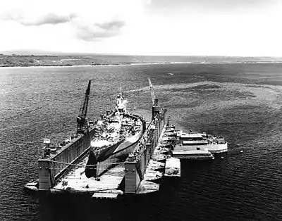 AFDB-1 with West Virginia (BB-48) high and dry in the dock