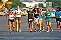 Final stretch of 52.4 mile run at the old airport. Participants frequently complete the journey with family, friends, and support crew