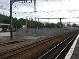 EMU storage area and row sidings at Upper Hutt railway station in a fenced part of the station yard. In the foreground are the crossing loop (left), and main line (right).