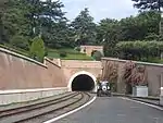 The tunnel to headshunt with parked tractor, looking north