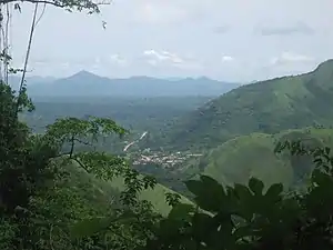 The Volta Region as depicted is lush green, covered in mountains, forests, farmland, and a small town in a valley in the center